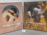 two books on a table with a picture of a man and a woman