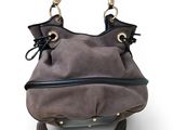 grey and black handbag with tassels on a white background