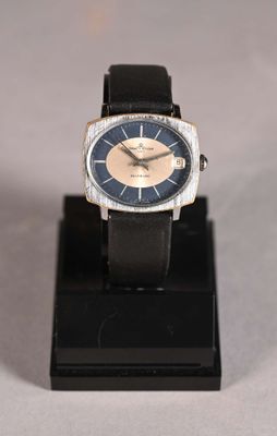 a watch that is on a stand on a table