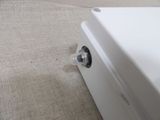 a close up of a white refrigerator on the floor