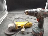 a corded drill and a power drill on a table