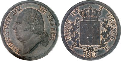 a close up of a coin with a crown on it