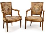 pair of louis xvi style walnut armchairs with tapestry upholstered seats