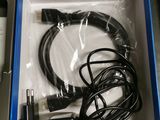 a box with a cable and a charger inside of it