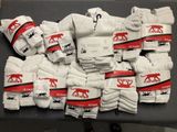 a table with a lot of white towels on it