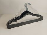 black plastic hanger with clear plastic cover on a white background