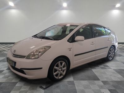 a picture of a white car parked in a garage