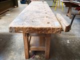 a wooden table that is sitting in the middle of a room