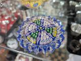 a glass table with a glass bowl on top of it
