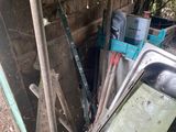 a pile of junk that is sitting outside of a building