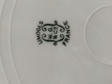 a white plate with a black design on it
