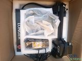 a box with a camera and a cell phone inside of it