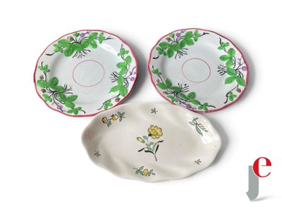 three plates with flowers on them on a white surface