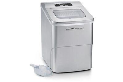 a close up of a small ice maker with a pair of ear buds