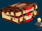 a lego man that is standing in front of a chest