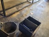 two buckets that are sitting on the floor next to each other