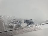 a plastic bag wrapped around a toothbrush on the edge of a sink