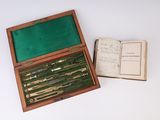 a box with a book open and a book in it