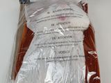 a bag of clothes that is wrapped up on a hanger