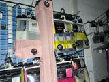 a rack with a pair of pink pants hanging on it