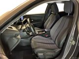 the interior of a car with the door open showing the driver ' s seat