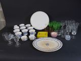 a table with a lot of glassware and plates on it