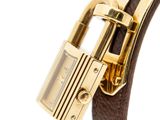 an image of a close up of a wrist with a padlock on it