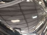 a close up of a shiny car with a broken windshield