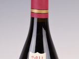 a bottle of wine that is sitting on a table