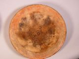 two plates that are sitting on a white table