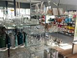 many glasses on the shelves in the store