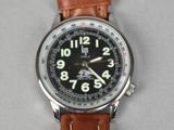 a close up of a wrist watch with a leather strap