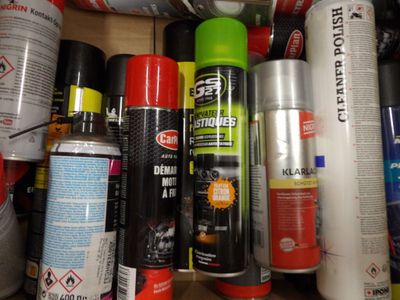 many different types of sprays and cans on the shelf