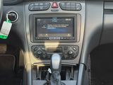 the interior of a car with a steering control and dashboard controls