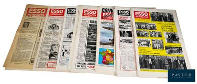 several old newspapers are stacked on top of each other on a white surface