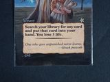 a card that has a picture of a man holding a sword