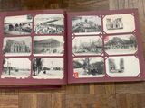 an open book with pictures of old buildings on it