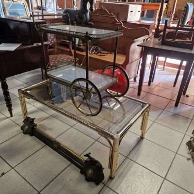 a table with a glass shelf on it in a room