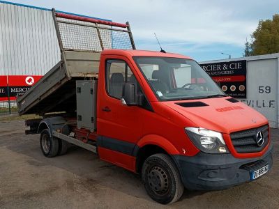 a red truck that is parked in a lot
