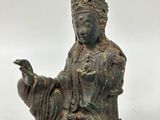 a statue of a woman holding a bird in her hand