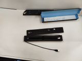 two pieces of paper and a stapler on a table