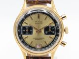 a close up of a wrist watch with a brown leather strap