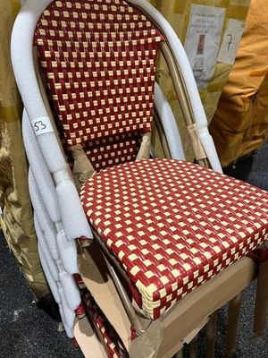 a chair with a red and white checkered seat pad on it