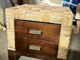 a small wooden table with a drawer on top of it