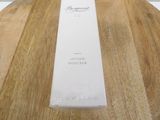 the box of the lotion douceur is sitting on a wooden table