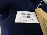 a label on the back of a blue sweater