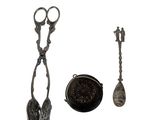 a pair of scissors and a spoon sitting next to each other