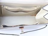 a white purse that is open on a white surface