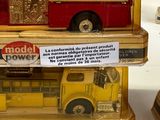 two models of fire trucks on display on a table