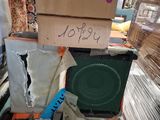a pile of boxes on top of a table with a speaker